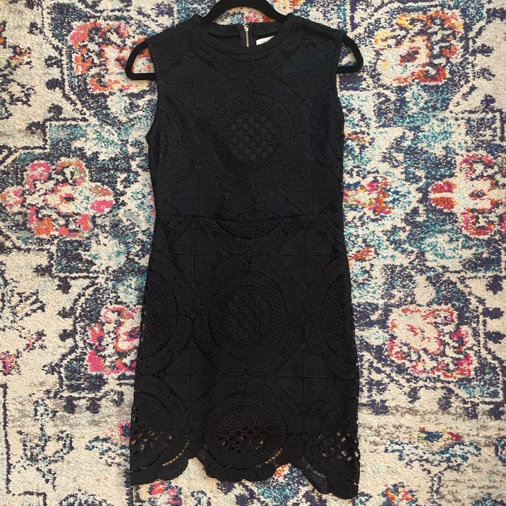 Stella Luce black crochet minidress with zipper back. Size M.